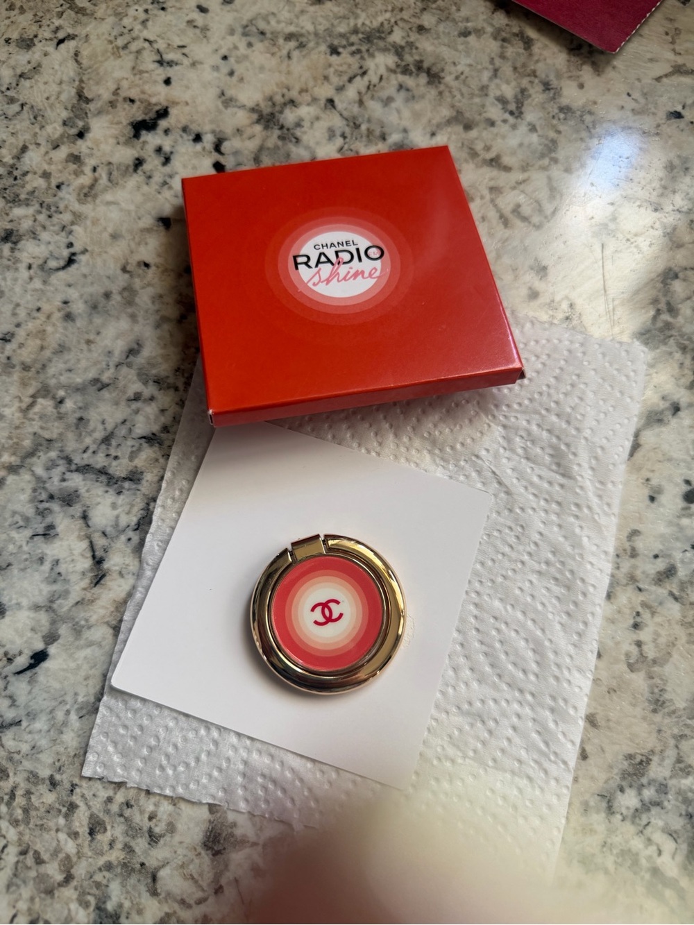 CHANEL Gold Phone Ring Holder with Coral Concentric Design